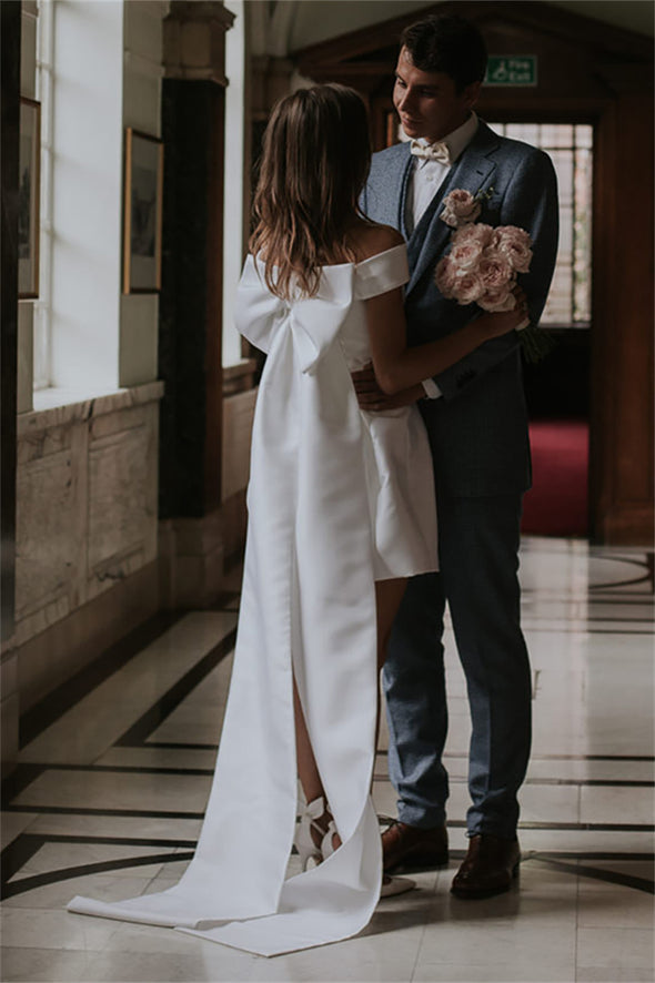 Minimalist Photography Bridal Gowns With Large Bow Train